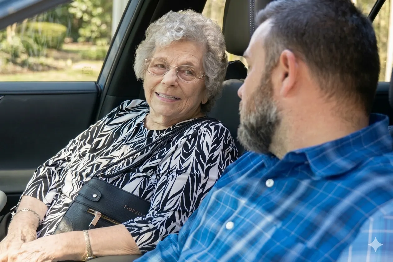 A Neighbor smiling from the passenger seat of a car